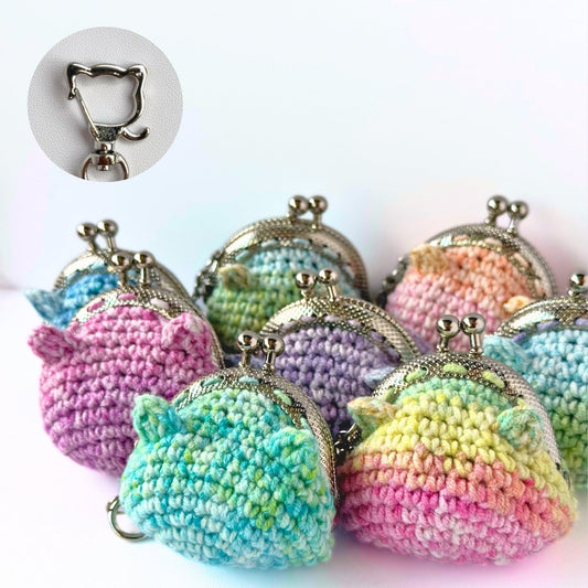 Colorful crocheted coin purses with a keychain clip on a white background.